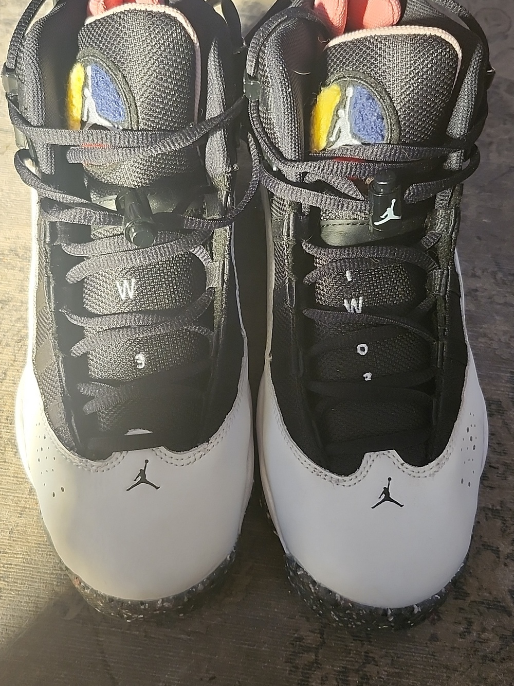 Jordan Black White Sneakers with Yellow Blue and Orange Tongue Accents